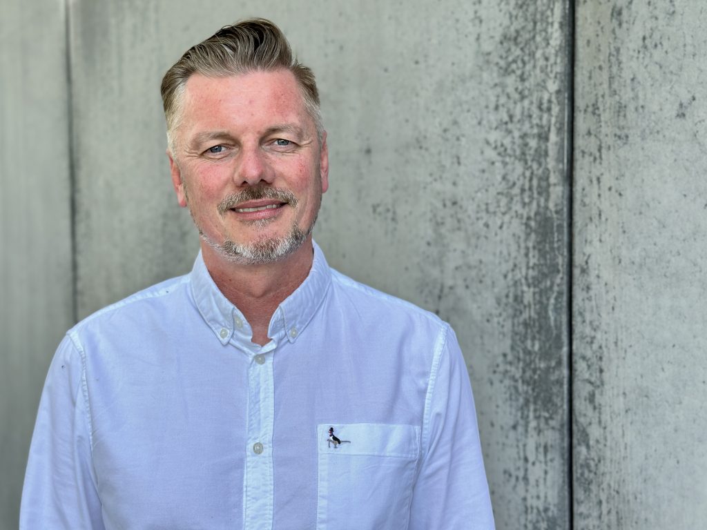 Colin Huffen head and shoulders smiling at camera outside