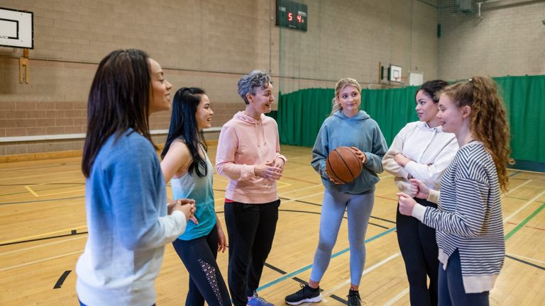 basketball school girls standing in sports hall