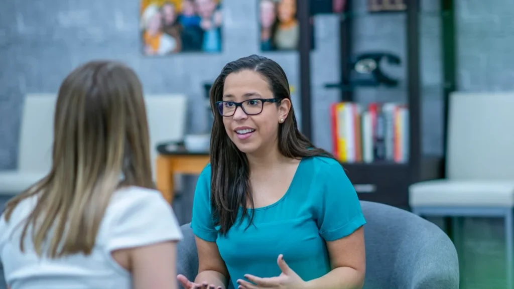 An exercise referral practitioner talking to a client