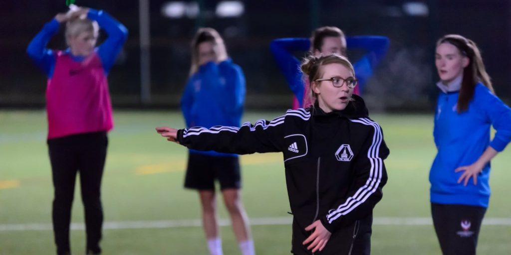 Coach coaching a sports session.