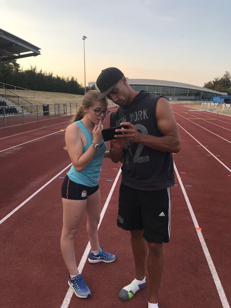 Ben and Molly in discussion on the running track
