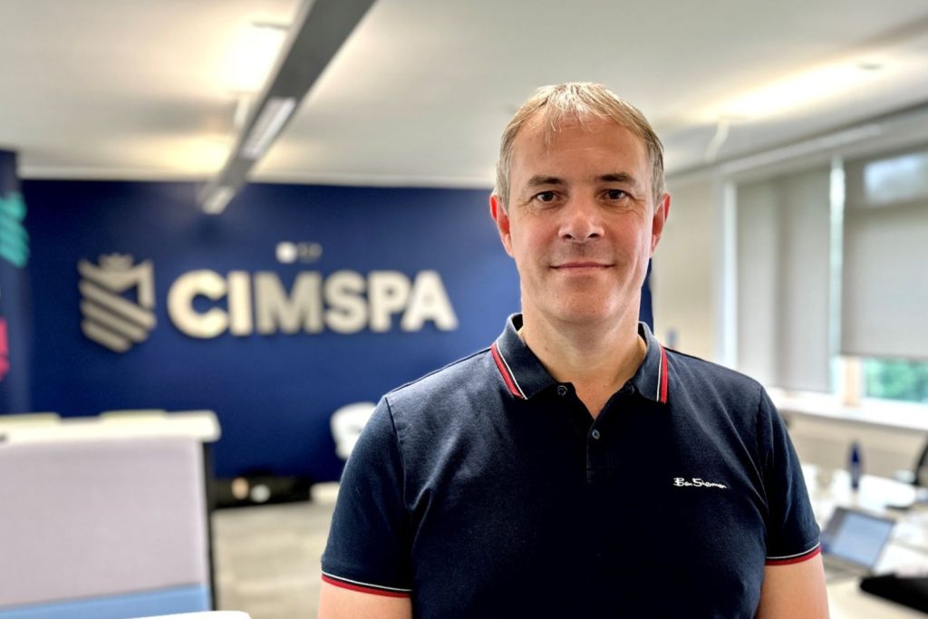 Spencer Moore headshot in CIMSPA office