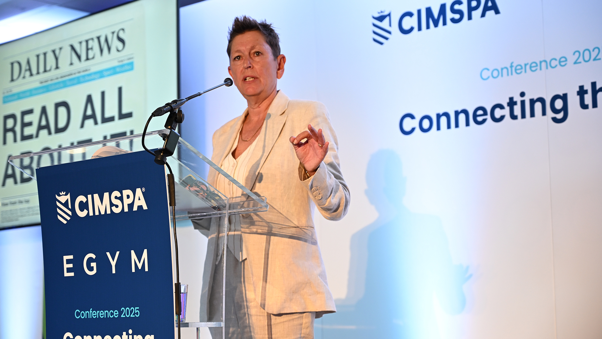 Tara Dillon on stage delivering conference speech