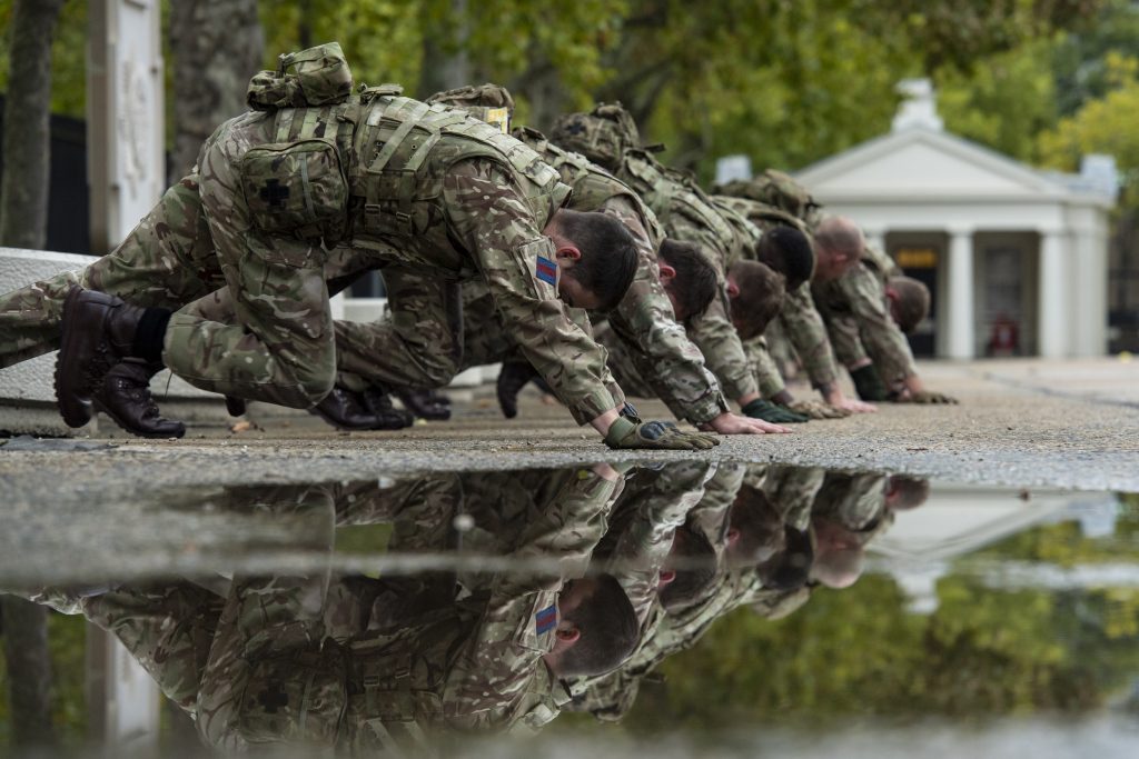 Soldiers in a line do mountain climbers