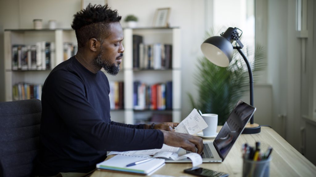Man calculating budget and finances