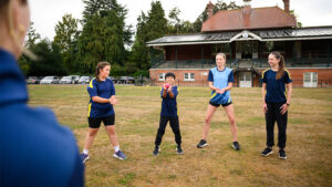 Grass routes women and girls cricket teams practicing at club